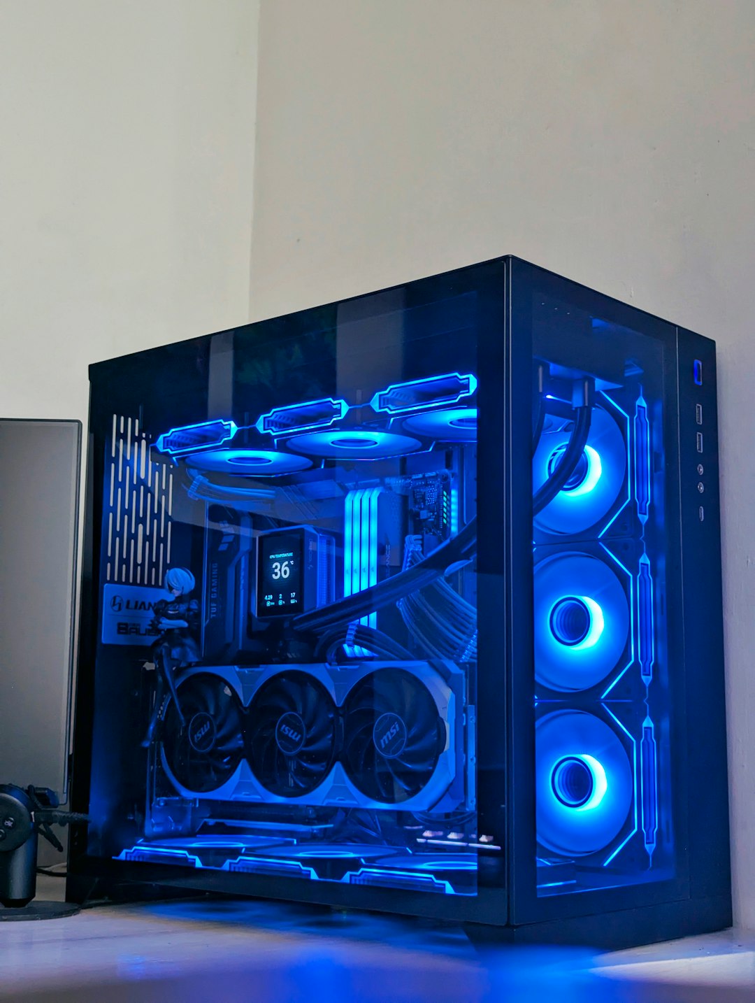 who-we-are Sleek PC build featuring a Lian Li case, vibrant RGB lighting, and powerful MSI components, perfect for gaming and high-performance computing.